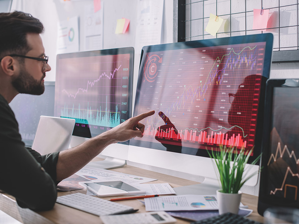 man working and checking data on computer
